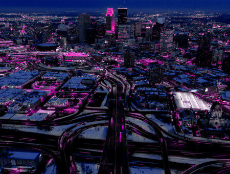 Birds eye view of large city with horizon in background