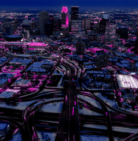 Birds eye view of large city with horizon in background