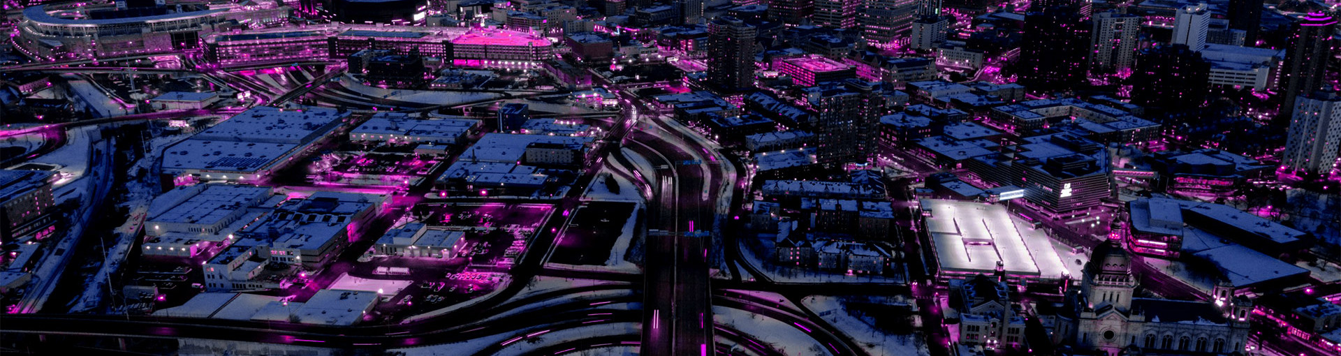 Birds eye view of large city with horizon in background