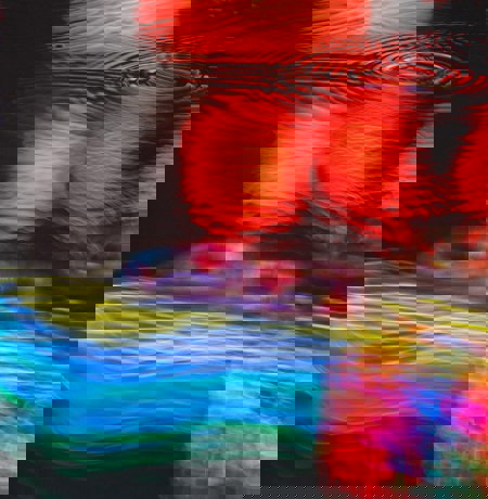 Neon light reflections in puddle