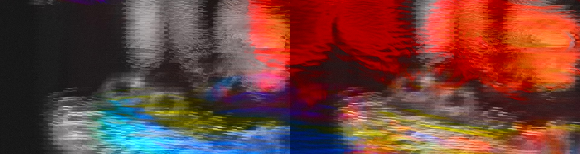 Neon light reflections in puddle