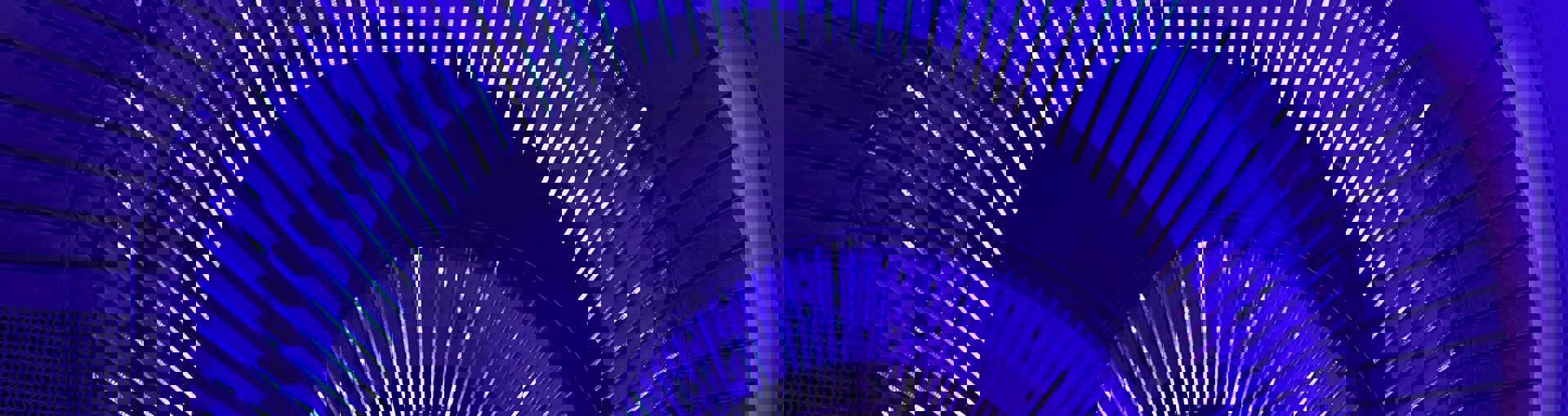 View of spiral staircase in neon blue lighting