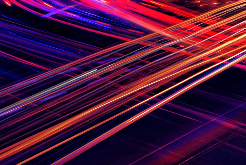 Red, Orange, And Blue Light Trails Streaking Across