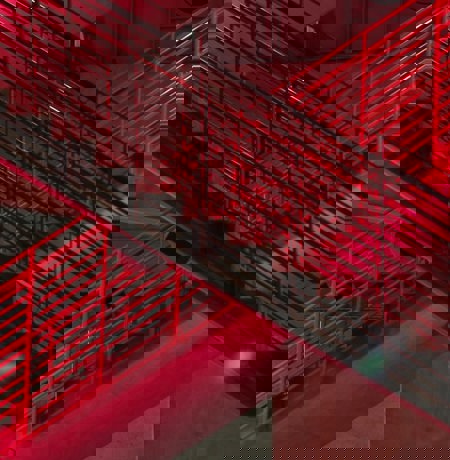 Image of red stairs in neon light