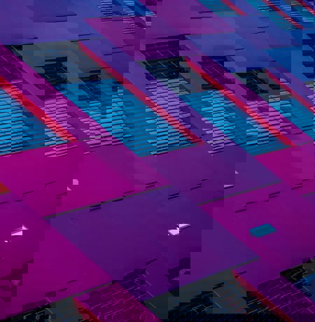 Abstract image of building with purple and blue panels and window frames