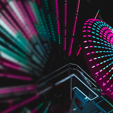Image of multi coloured neon ferris wheel