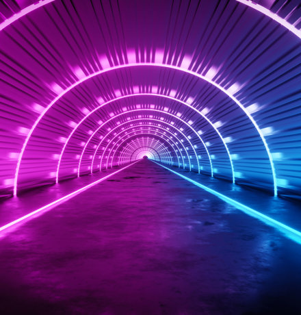 Tunnel with neon lights in a semi-circle into the horizon