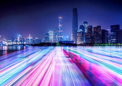 Neon lit cityscape with linse going to horizon