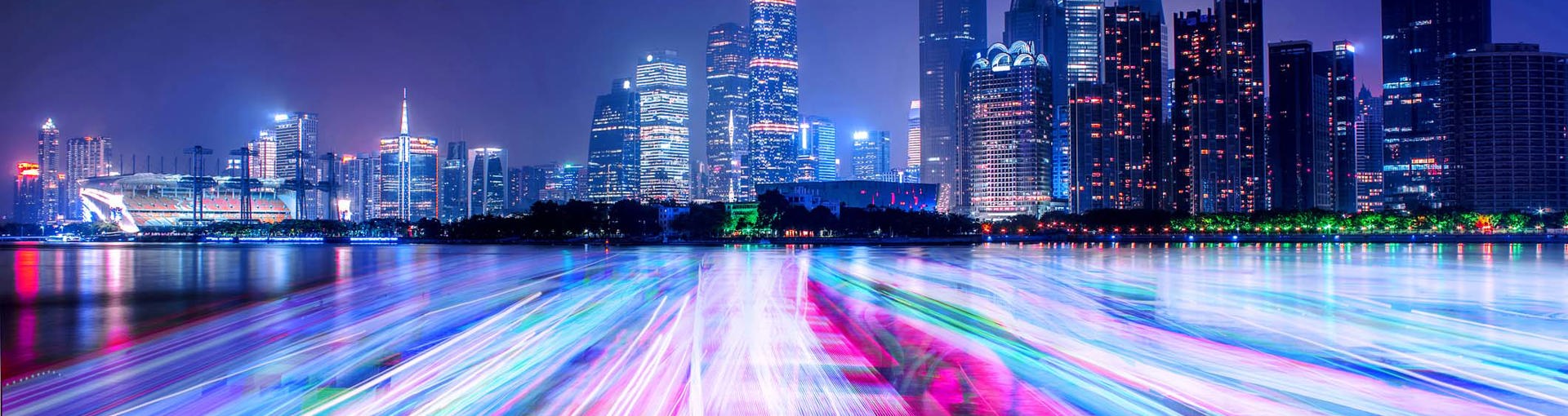 Neon lit cityscape with linse going to horizon