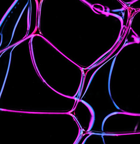 Close up of bubbles with neon highlights