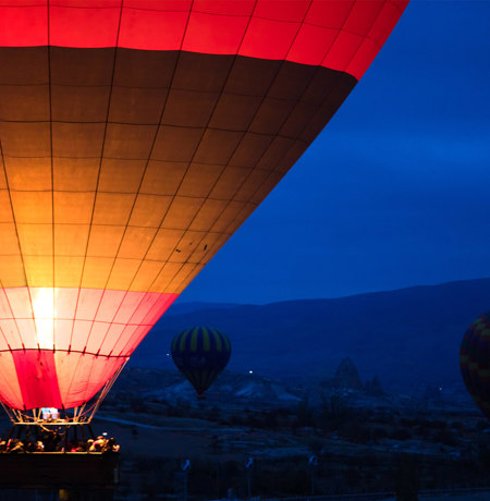 Hot air balloons against a night sky