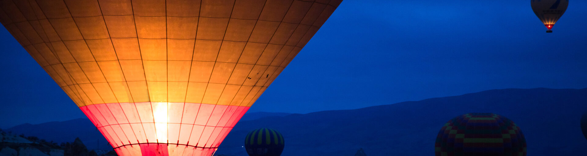 Hot air balloons against a night sky